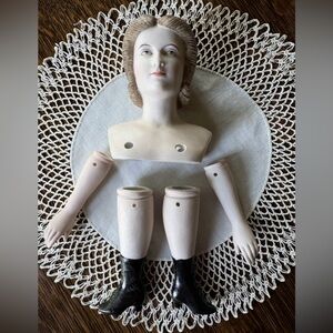 This 1950s doll kit is made of hand-painted porcelain & is marked Japan. BR